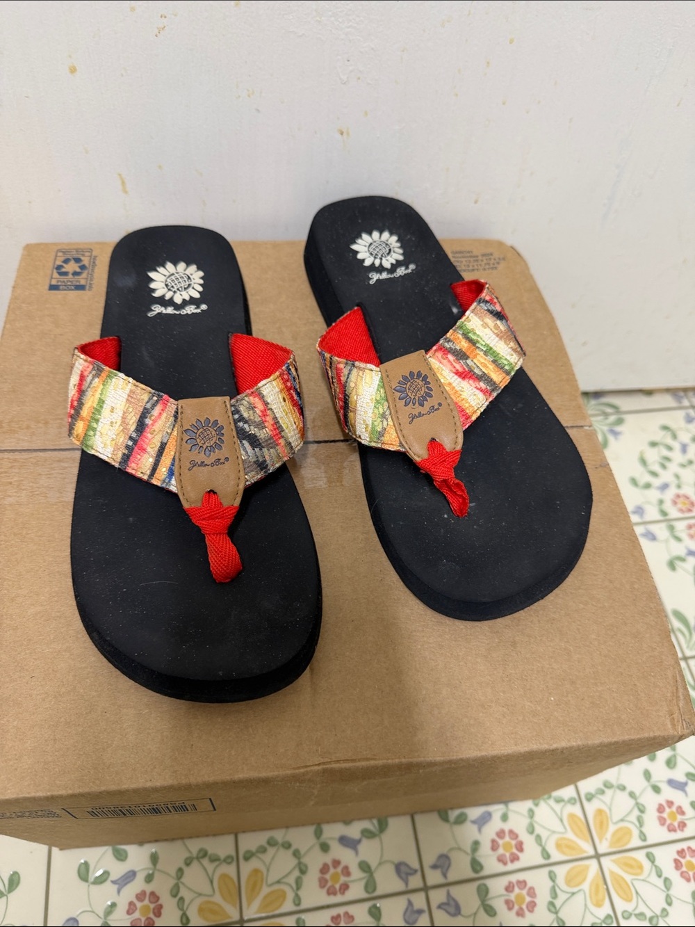 Yellow Box Black Sandals with Red and Multicolor Woven Straps